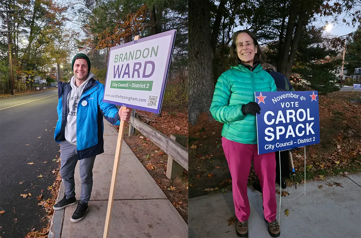 Candidates Brandon Ward and Carol Spack holding election signs